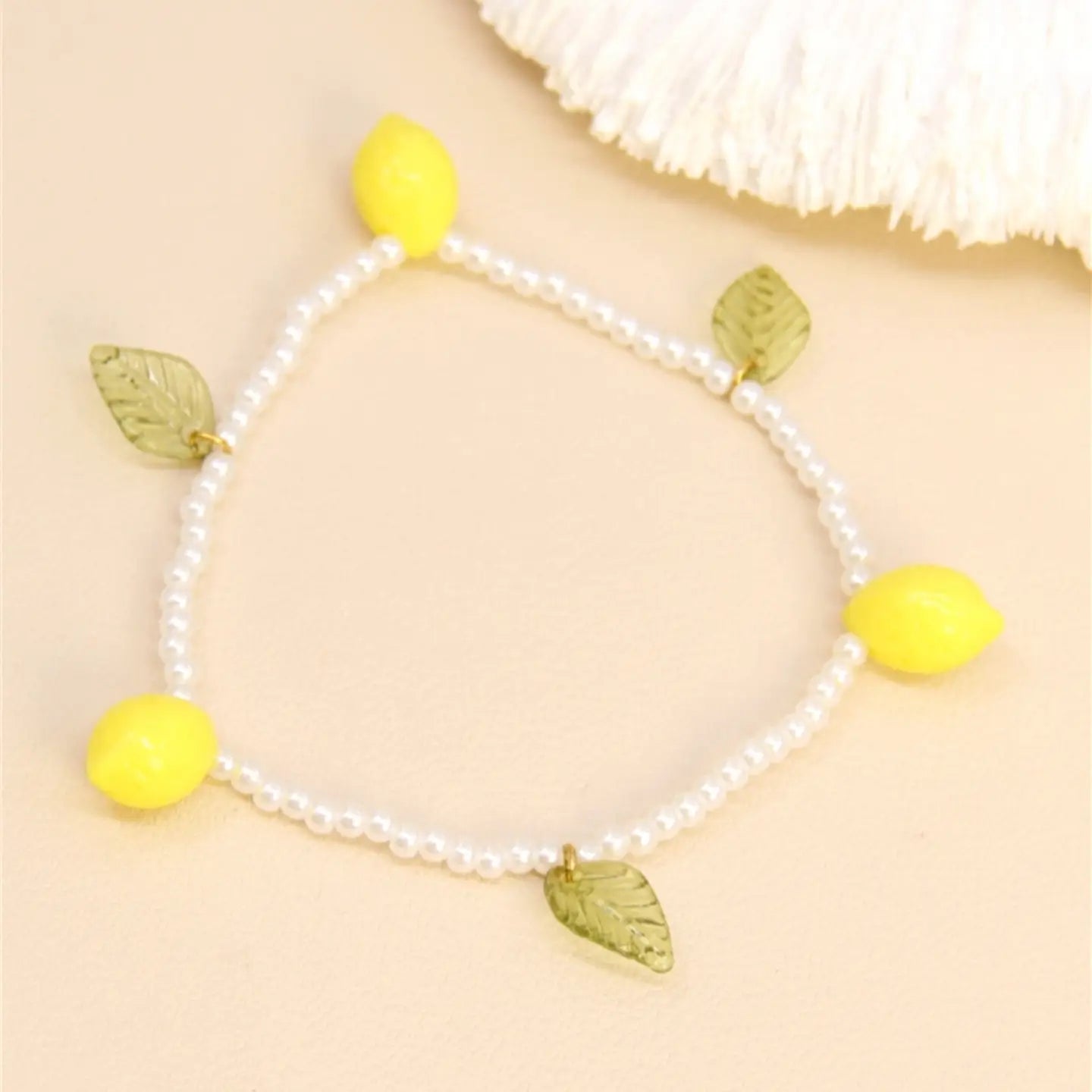 Bracciale Perle & Charms – Freschezza Acidulata.